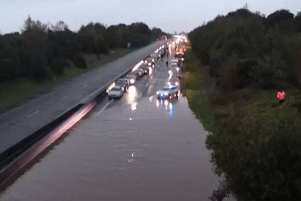 Total chaos on M8 Motorway after heavy rains flood carriageway causing a massive tailback