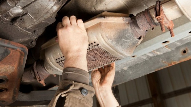 Catalytic converter being stolen