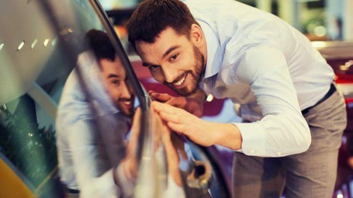 Man Inspecting Car